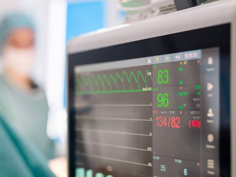 A hospital nurse’s station or bedside patient monitoring system with clear, modern UI