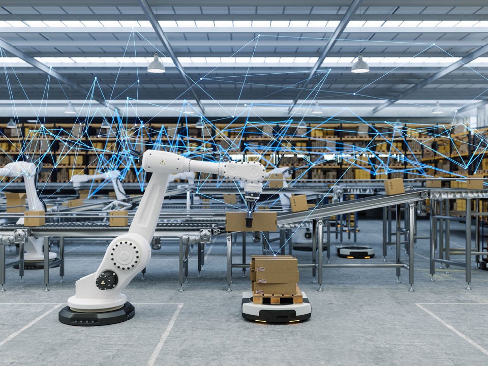 Robotics arm in fulfillment warehouse with AMRs and boxes