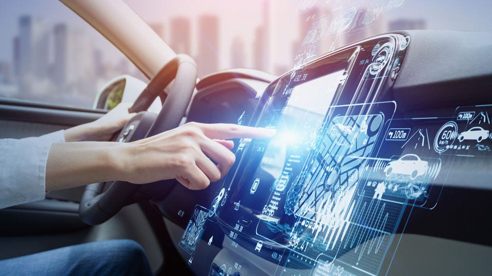 Driver's hand touching holographic interface in console