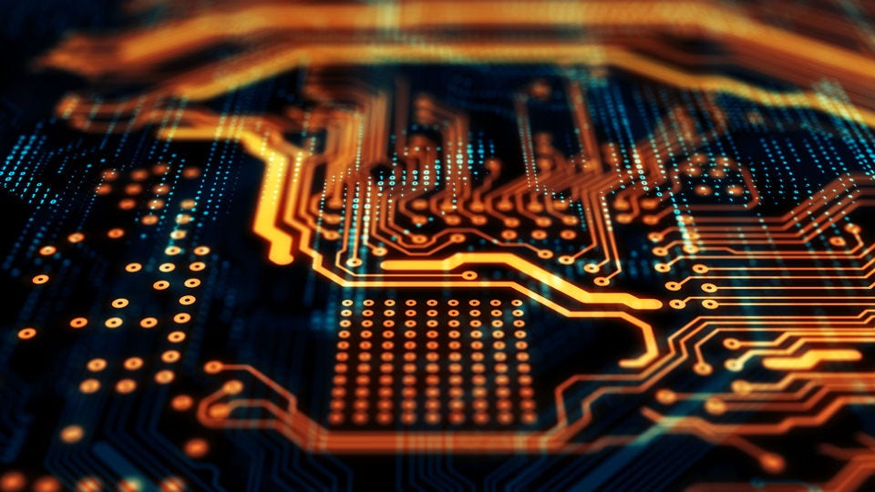 Orange/blue PCB with vignetted focus and highlight