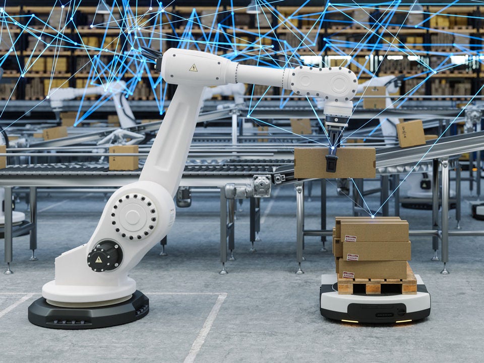 Robotics arm in factory loading AMR