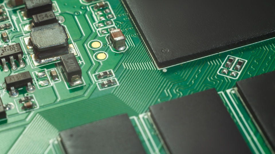 Green circuitboard macro/close-up of ICs