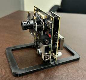 iENSO CV75 Eval Kit - embedded camera in board mounted on frame on desk