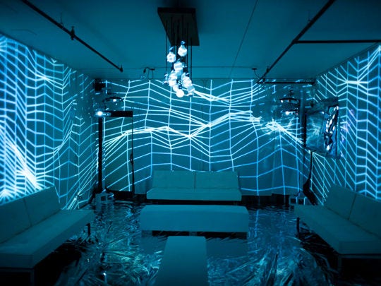 Projection mapping room with distorted vector grids