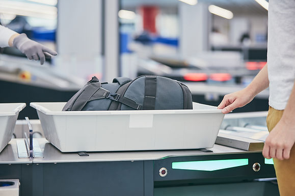 Inspection of suitcases at airports using X-Ray. Source: Envato.