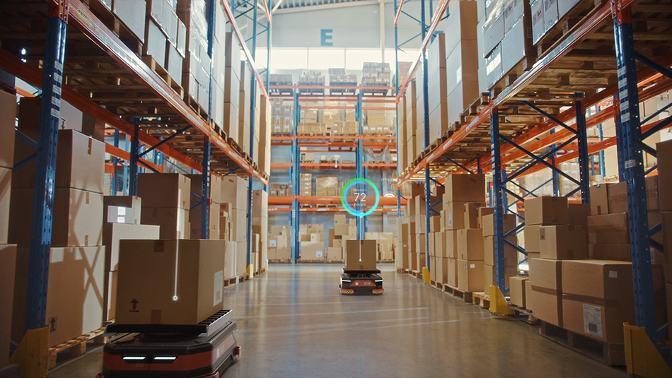 Warehousing management and AGV/AMR A warehouse filled with numerous packages stacked neatly on shelves and pallets. The vast space is organized, with boxes of various sizes labeled and ready for distribution.